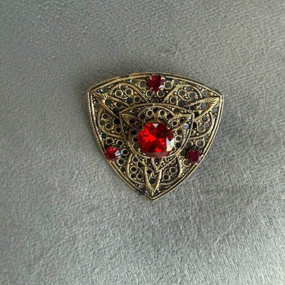 Vintage filigree broach with red stones